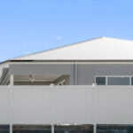 PVC Full Privacy Fencing Dawson style as a retaining wall fence,